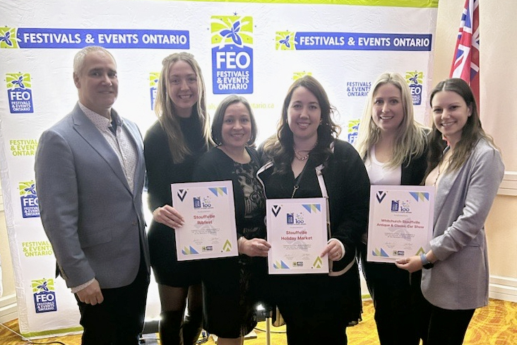 A photograph of Stouffville Town Staff with their three FEO awards. 