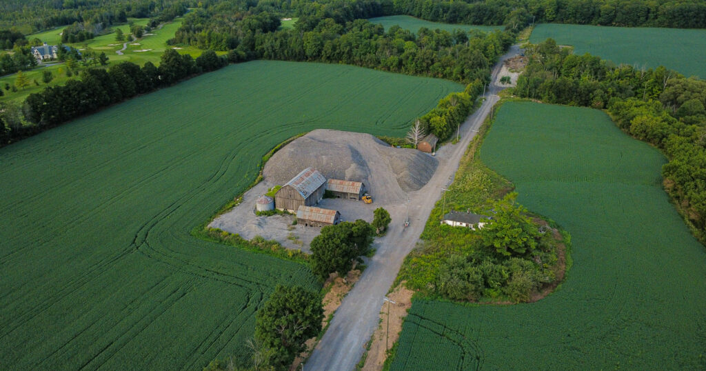An aerial photograph showing a stockpile of asphalt grindings at 2499 York-Durham Line in Uxbridge.
